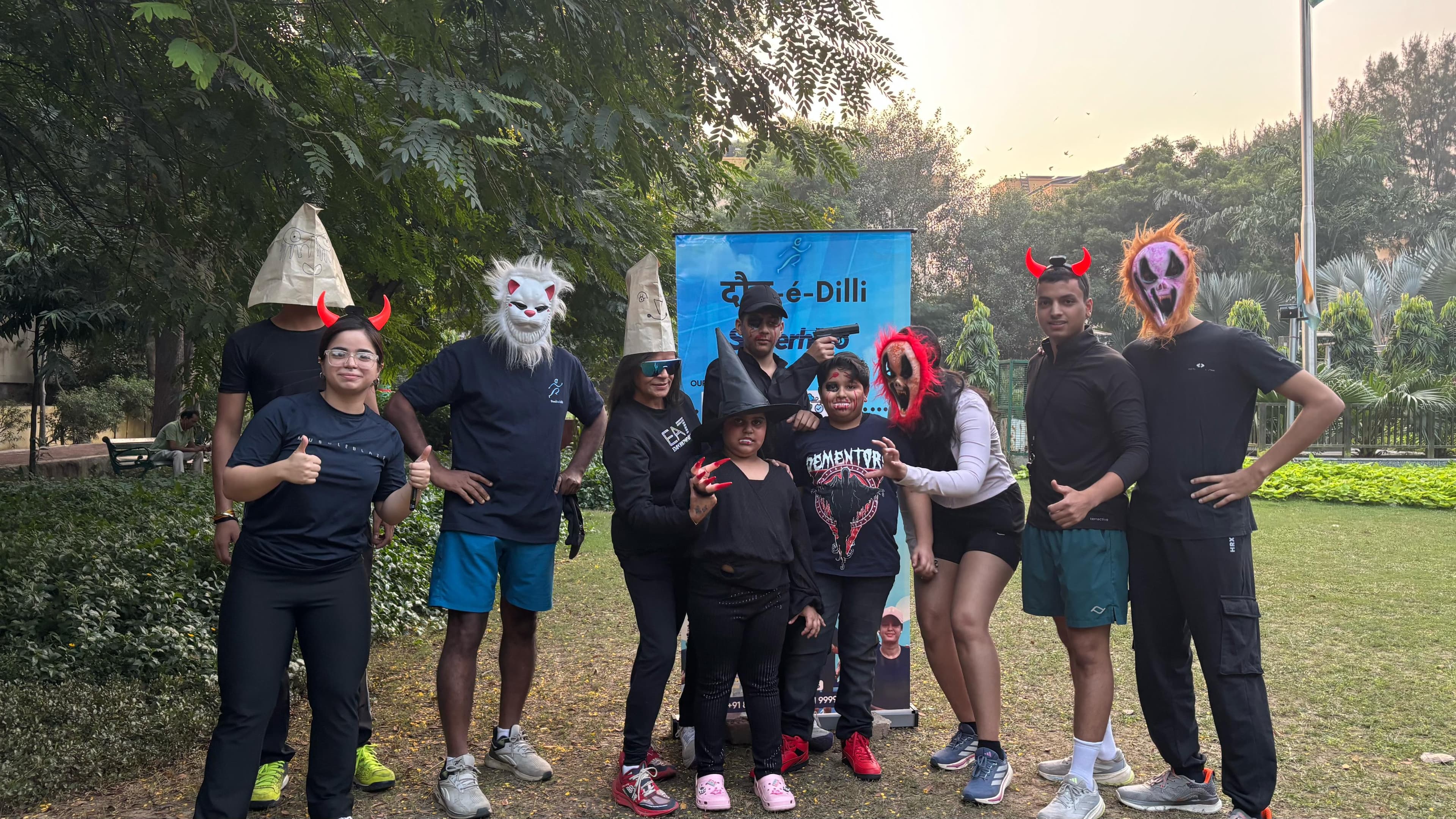 Enthusiastic Daud-È-Dilli runners crossing the finish line with medals